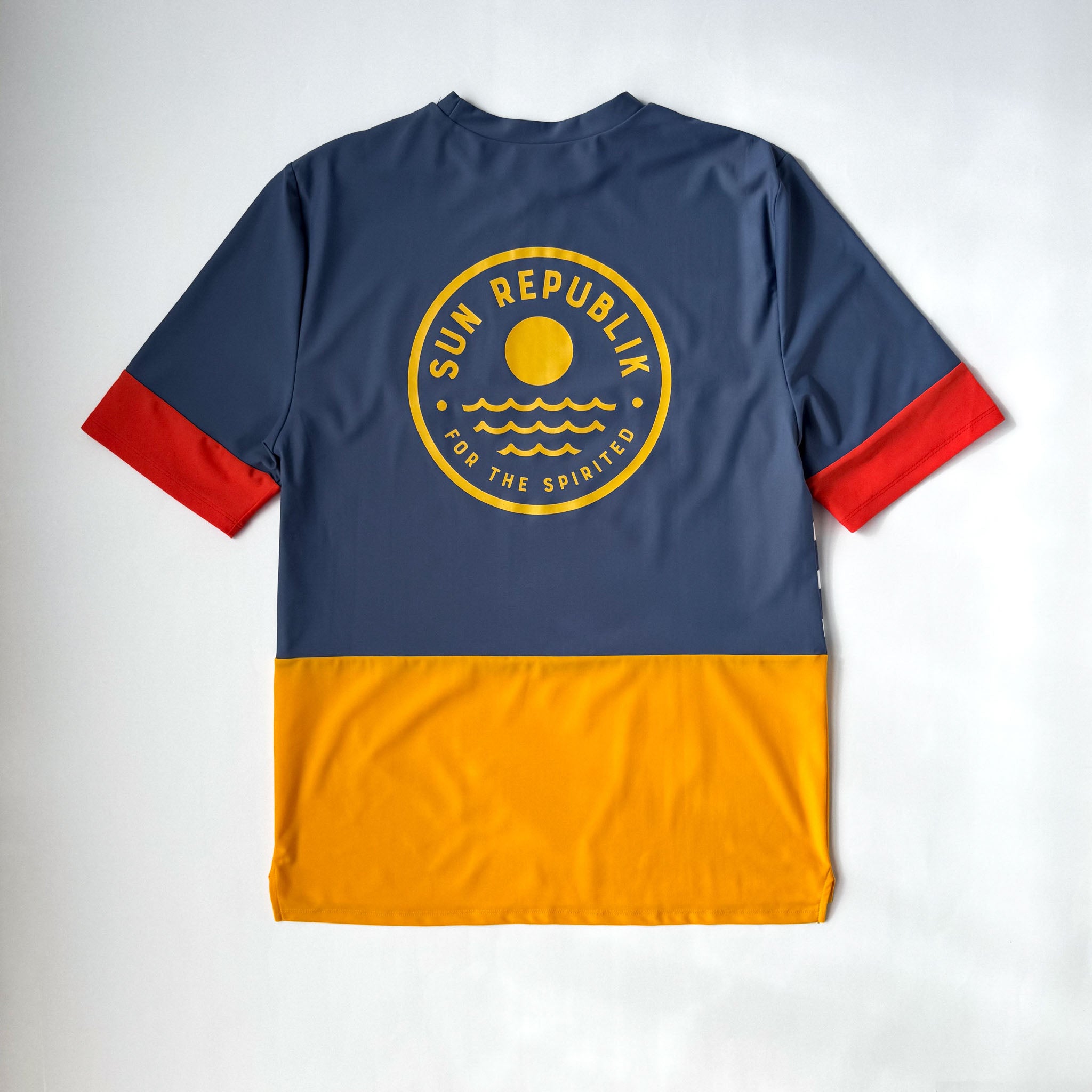 Mens beach wear, swim top, short sleeve and back logo. On white background.