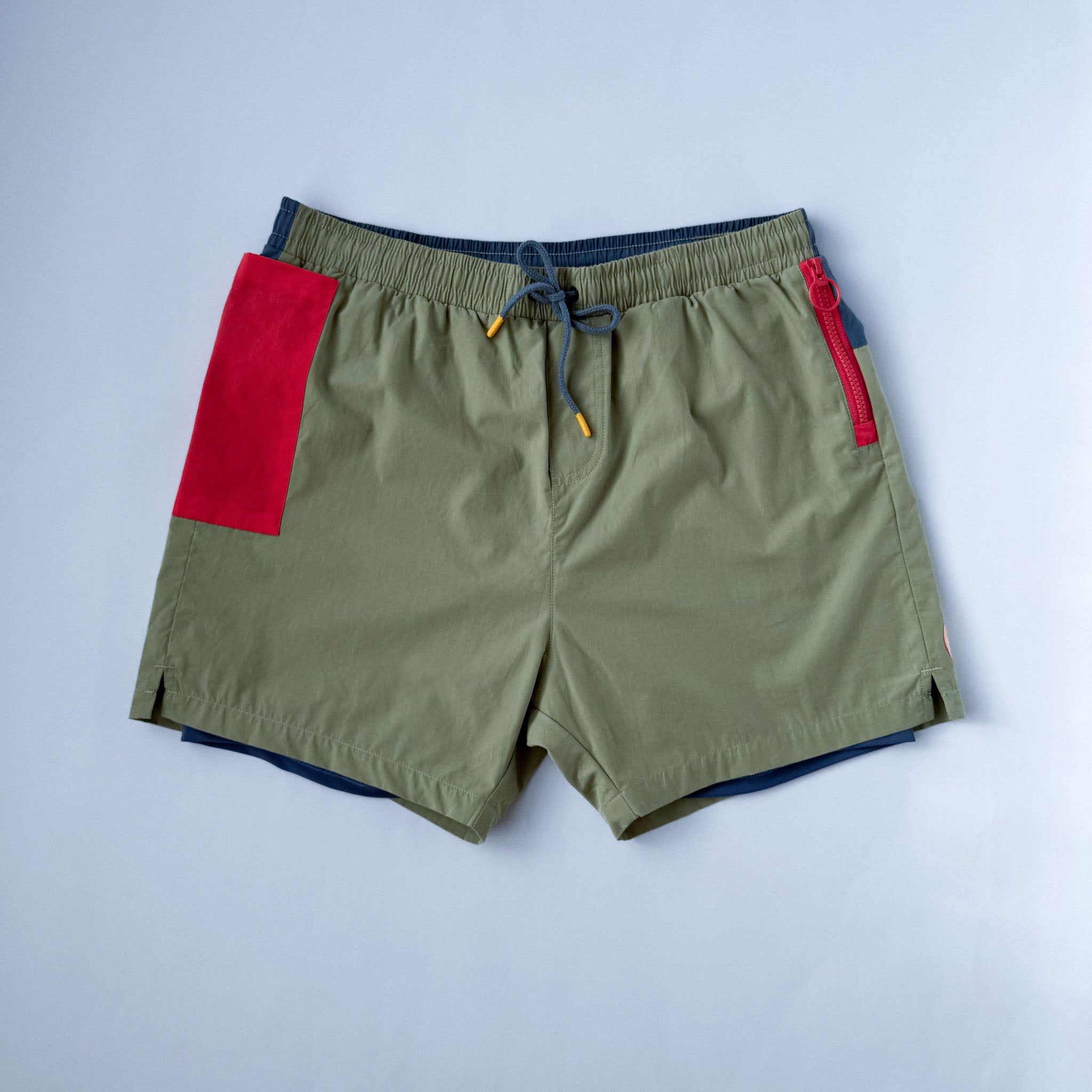 Men swim shorts with blue liner and phone pocket.  Front view on white background.