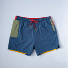 Mens beach wear with green phone pocket and inner liner on white background.